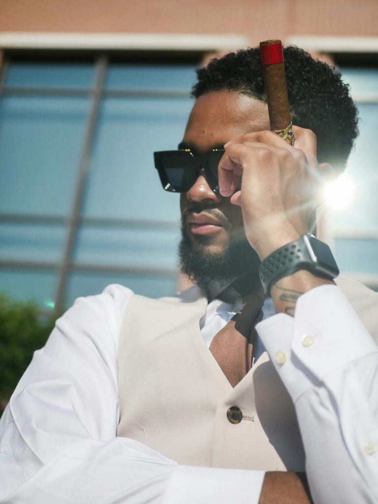 A man with a cigar in his hand