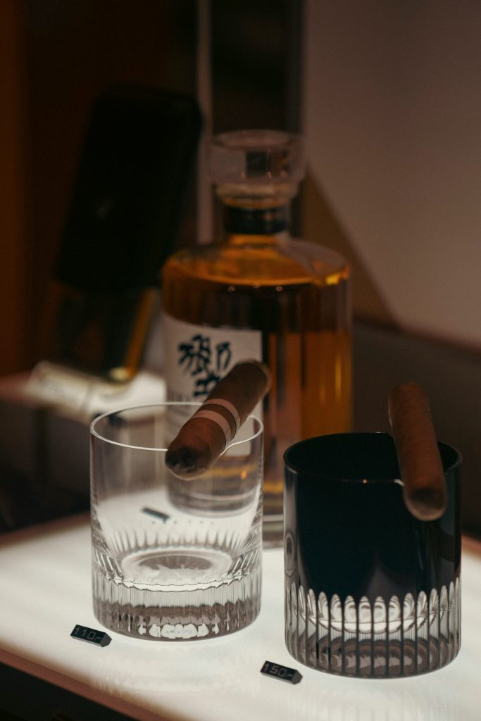 a bottle of alcohol and a glass on a table